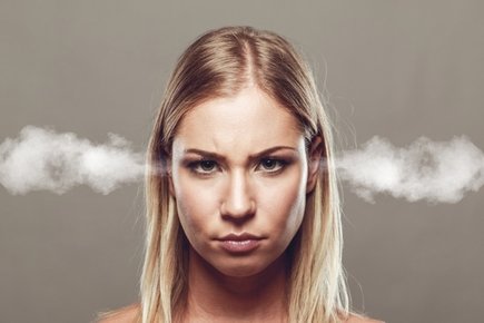 Angry woman with steam coming out of her ears